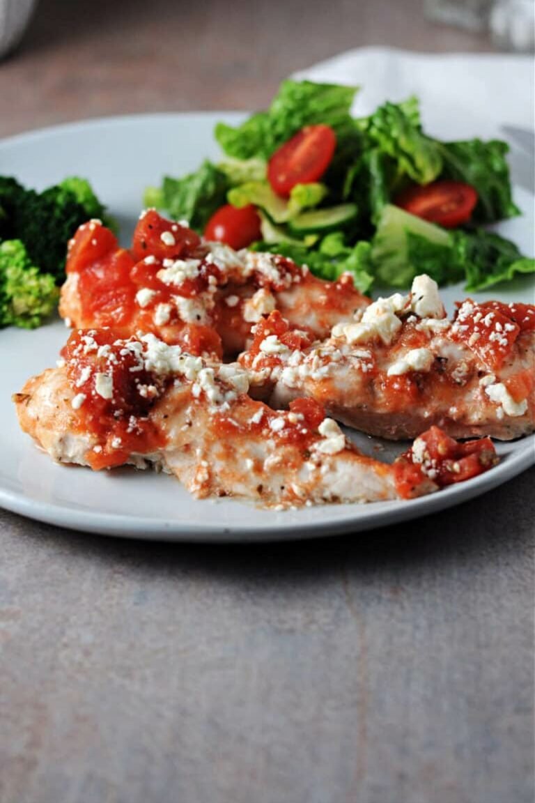 Baked Feta Chicken Tenders in a white plate.