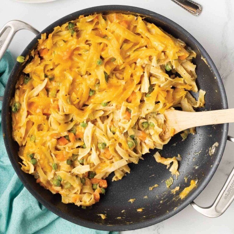 Cheesy Tuna Casserole in a black frying pan.