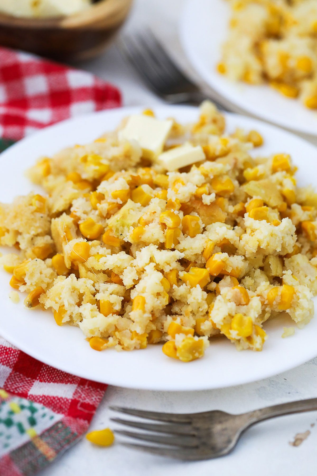 Cornbread casserole served in a white plate.