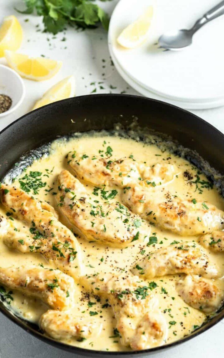 Creamy Lemon Chicken in a black circle platter.