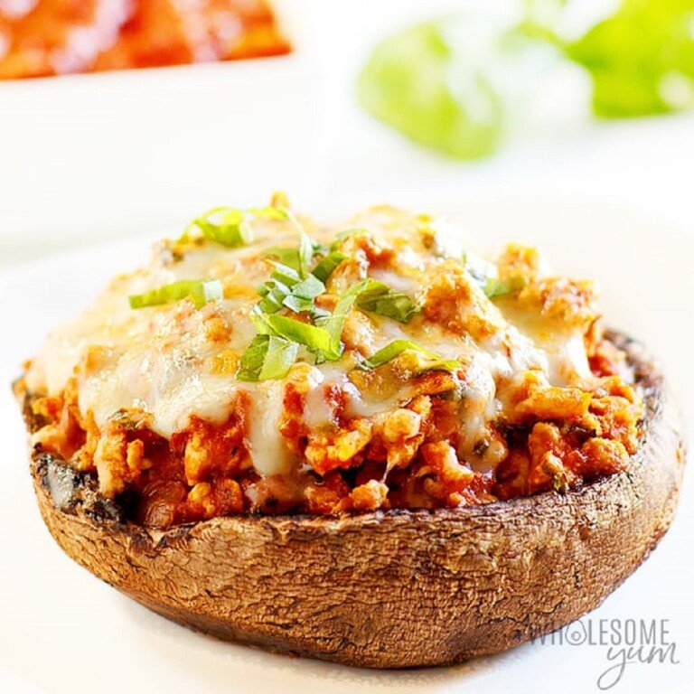 Keto Italian Stuffed Mushroom on a white surface.