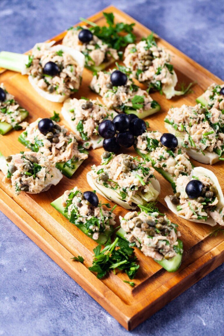 Fennel Cucumber bites on a wooden serving board.