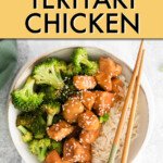 teriyaki chicken in a bowl with broccoli and rice, with chopsticks resting on the edge