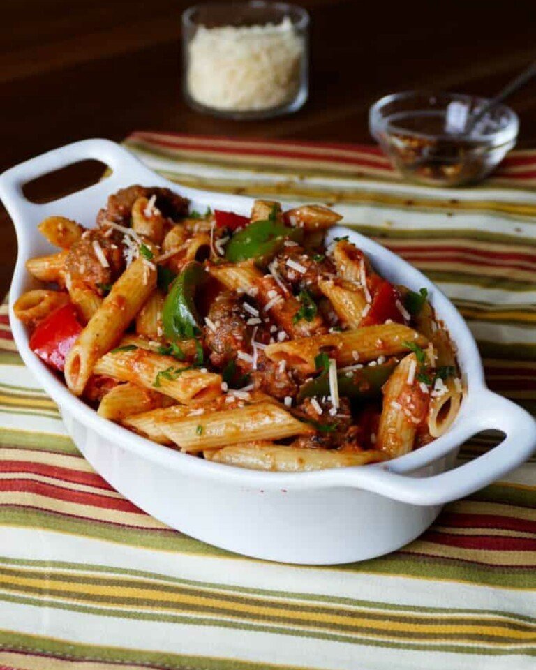 Instant Pot Sausage Pasta In Creamy Tomato Sauce on a colorful tablecloth