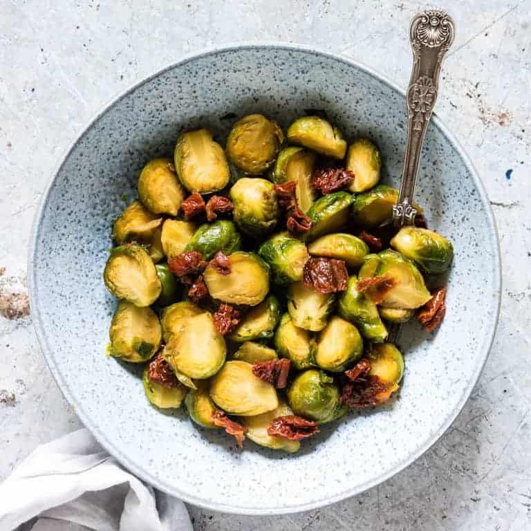 a plate of instant pot brussel sprouts with sundried tomatoes