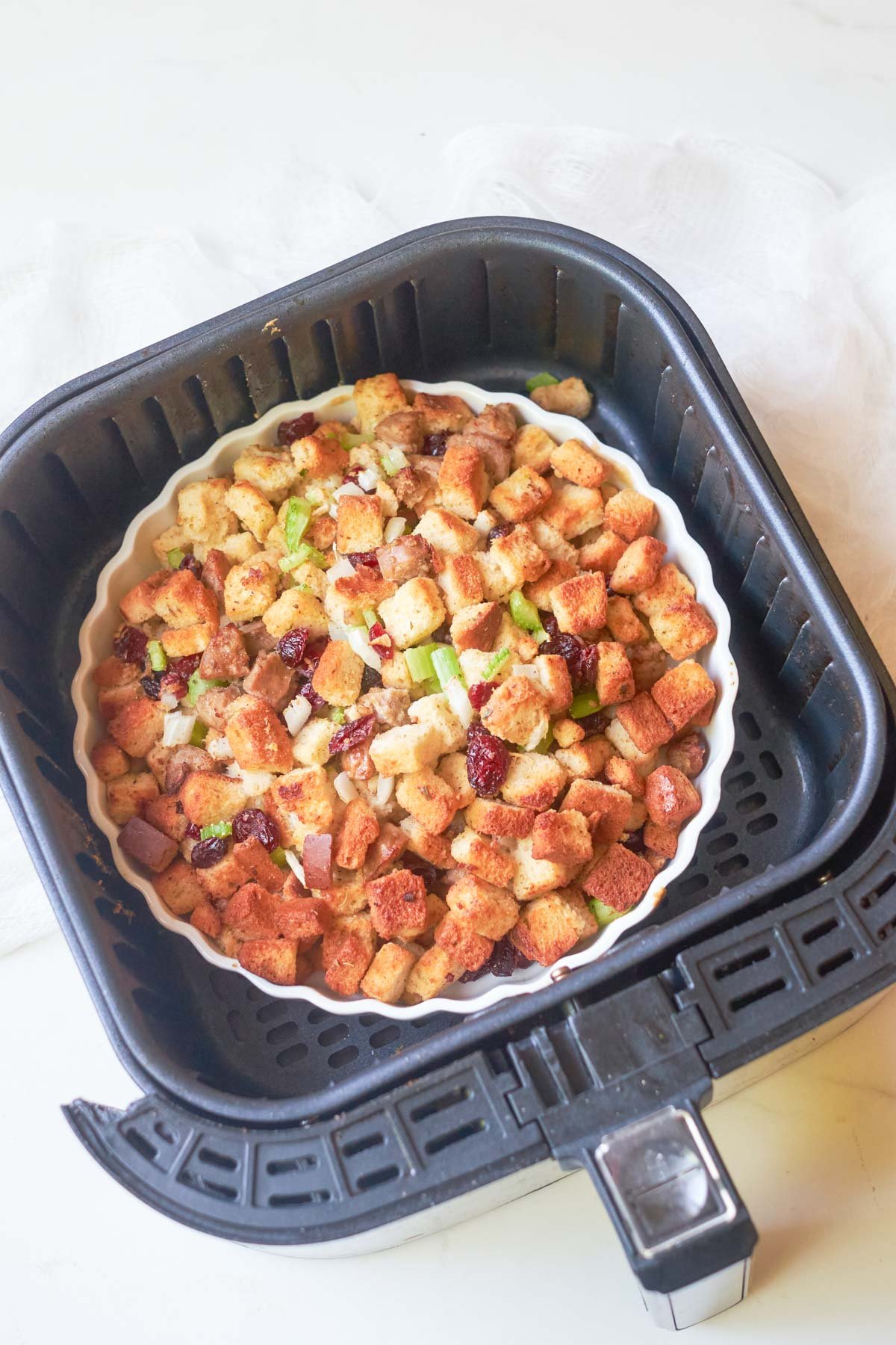 top down view of the cooked air fryer stuffing inside the air fryer basket