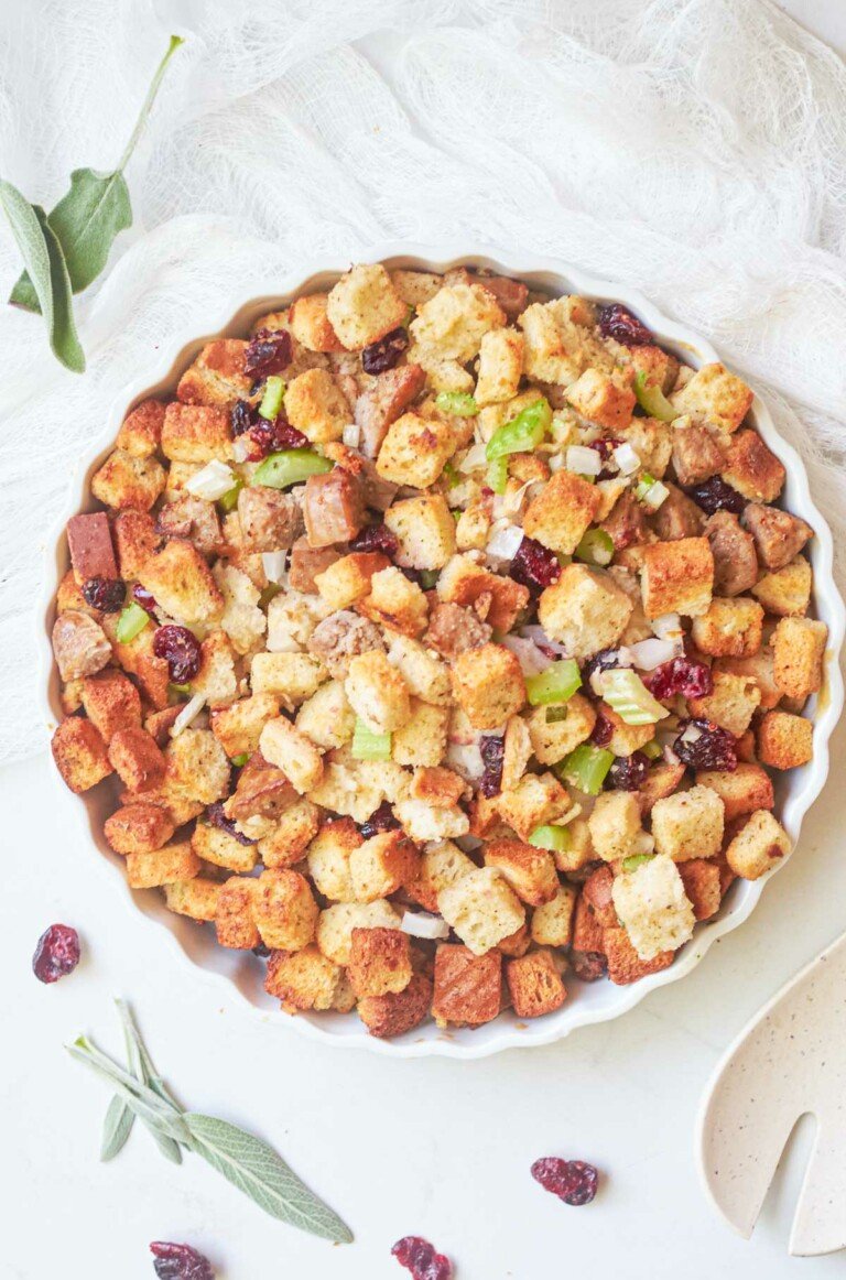 the completed air fryer stuffing in a white dish and ready to serve