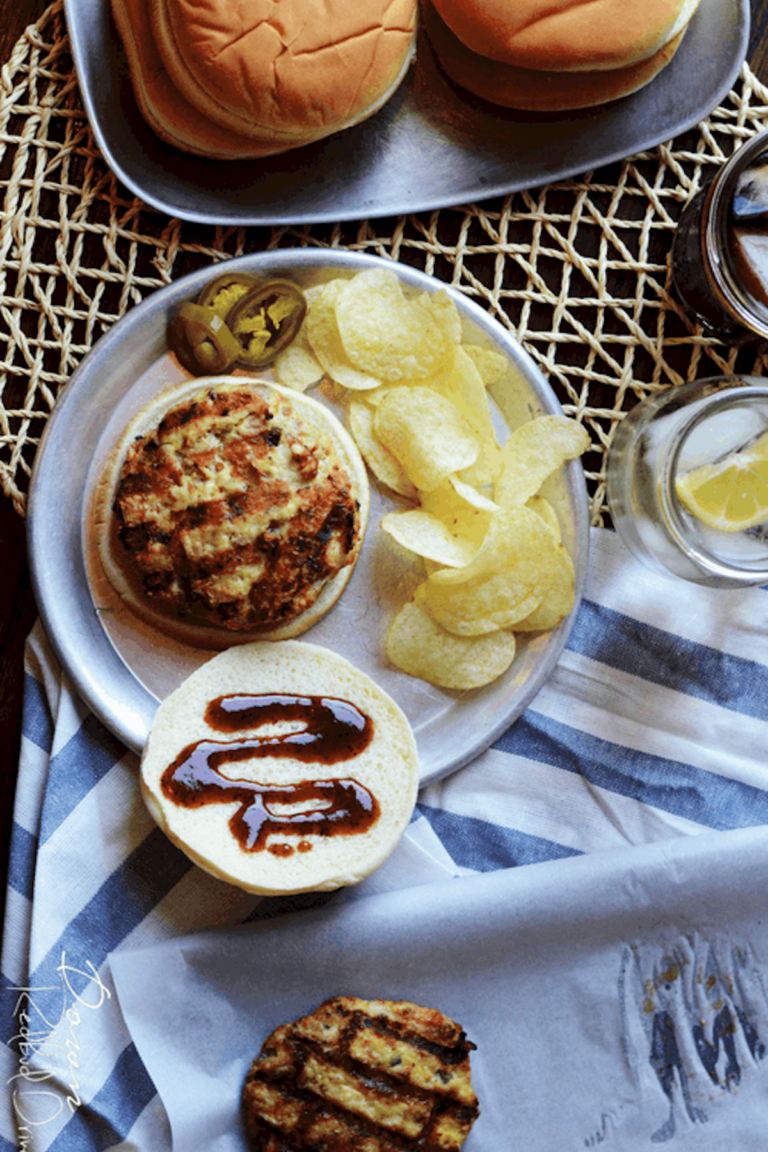 top down view of Cowboy Chicken Patties served with buns, jalapeno peppers, and potato chips