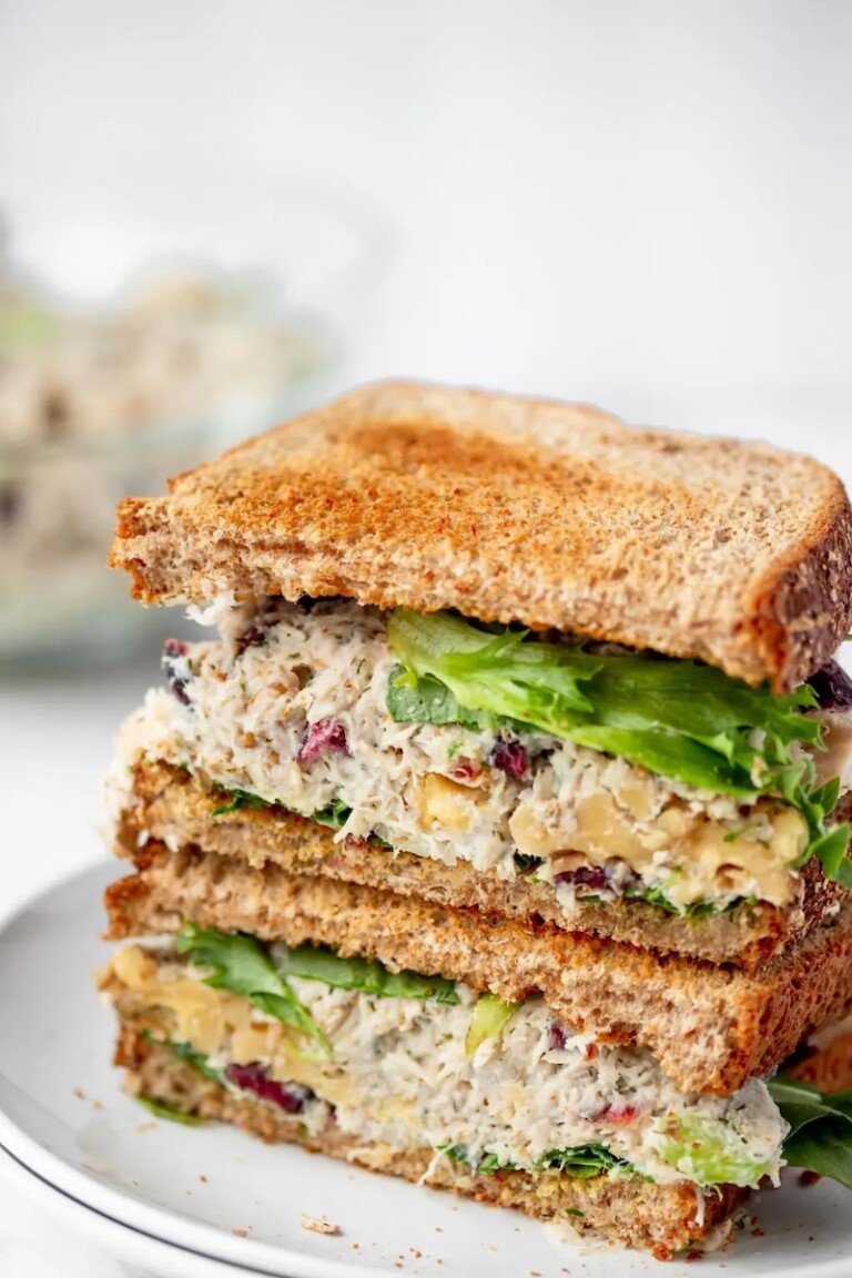 a sandwich made with cranberry walnut chicken salad