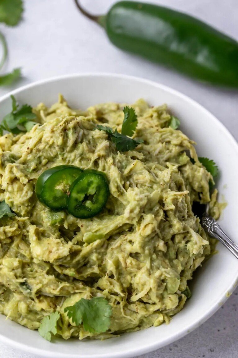 top down view of a bowl filled with guacamole chicken salad