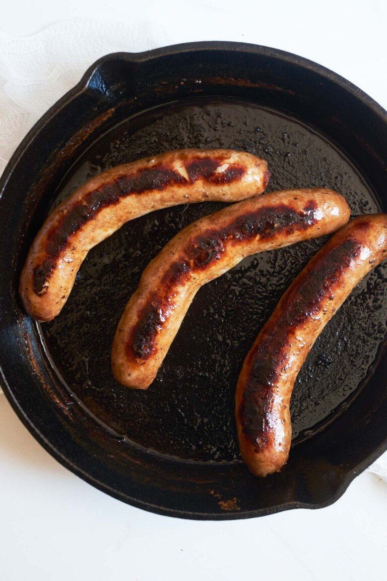 top down view of the cooked italian sausages in a skillet