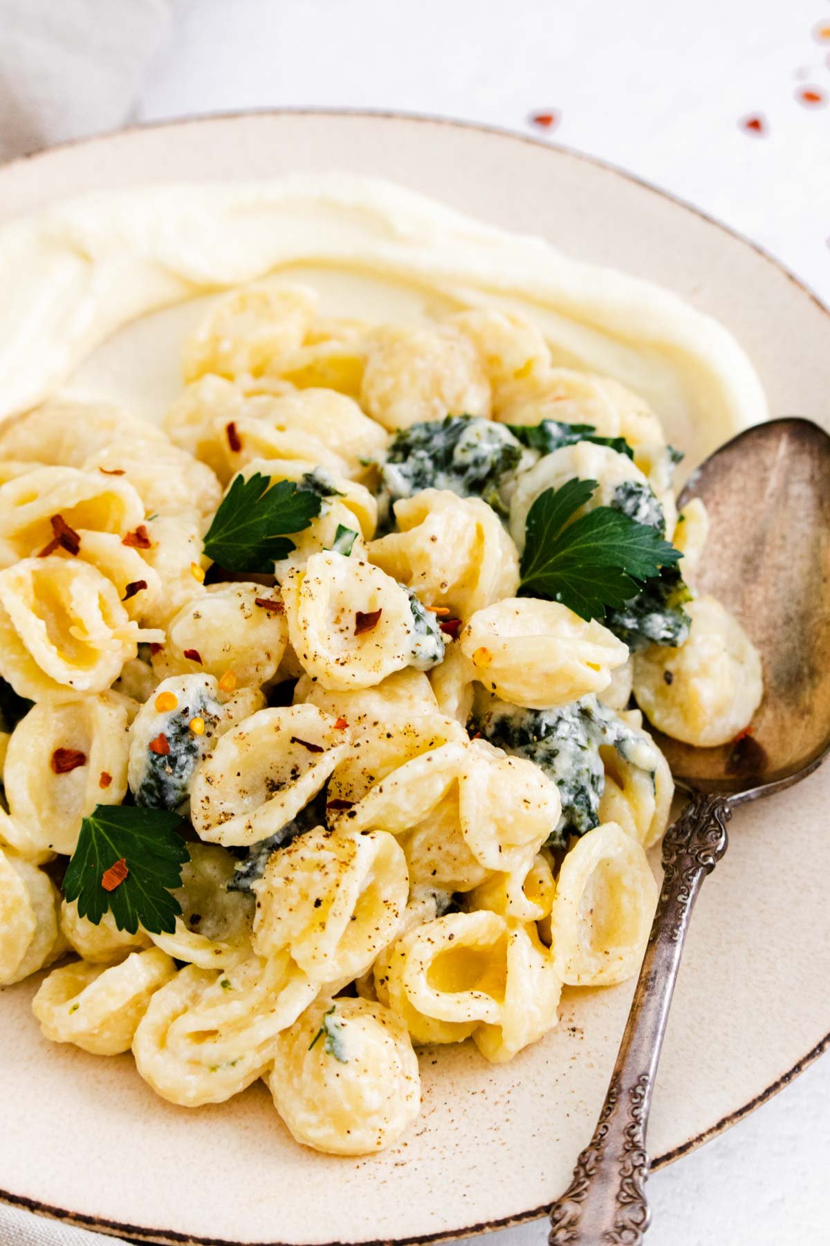 one serving of instant pot orecchiette on a plate with a large spoon