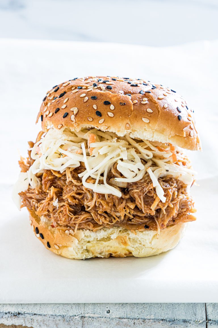 close up view of a finished instant pot pulled chicken sandwich