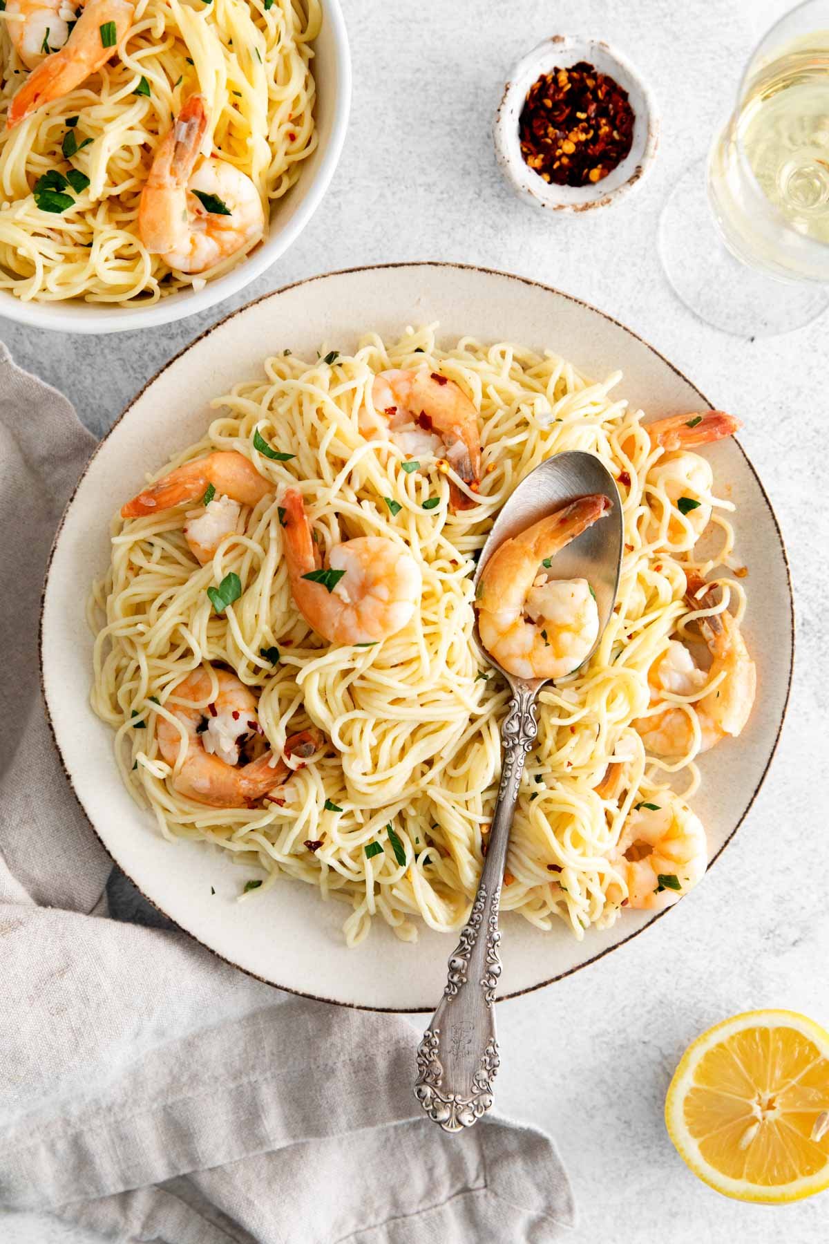 top down view of a serving of instant pot shrimp scampi with a spoon