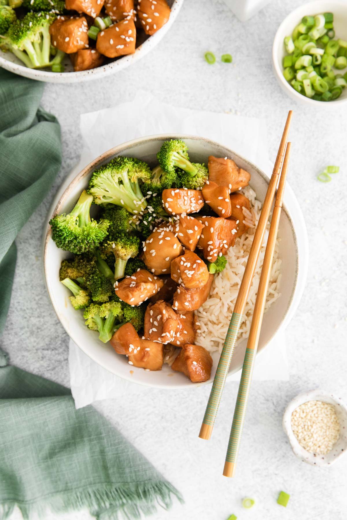 top down view of the completed instant pot teriyaki chicken served in a bowl with a pair of chopsticks