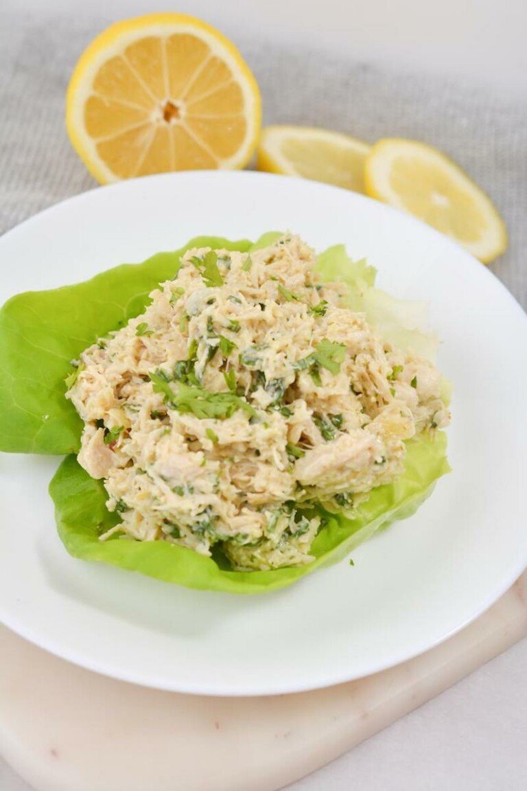 the finished lemon basil chicken salad served on a bed of lettuce