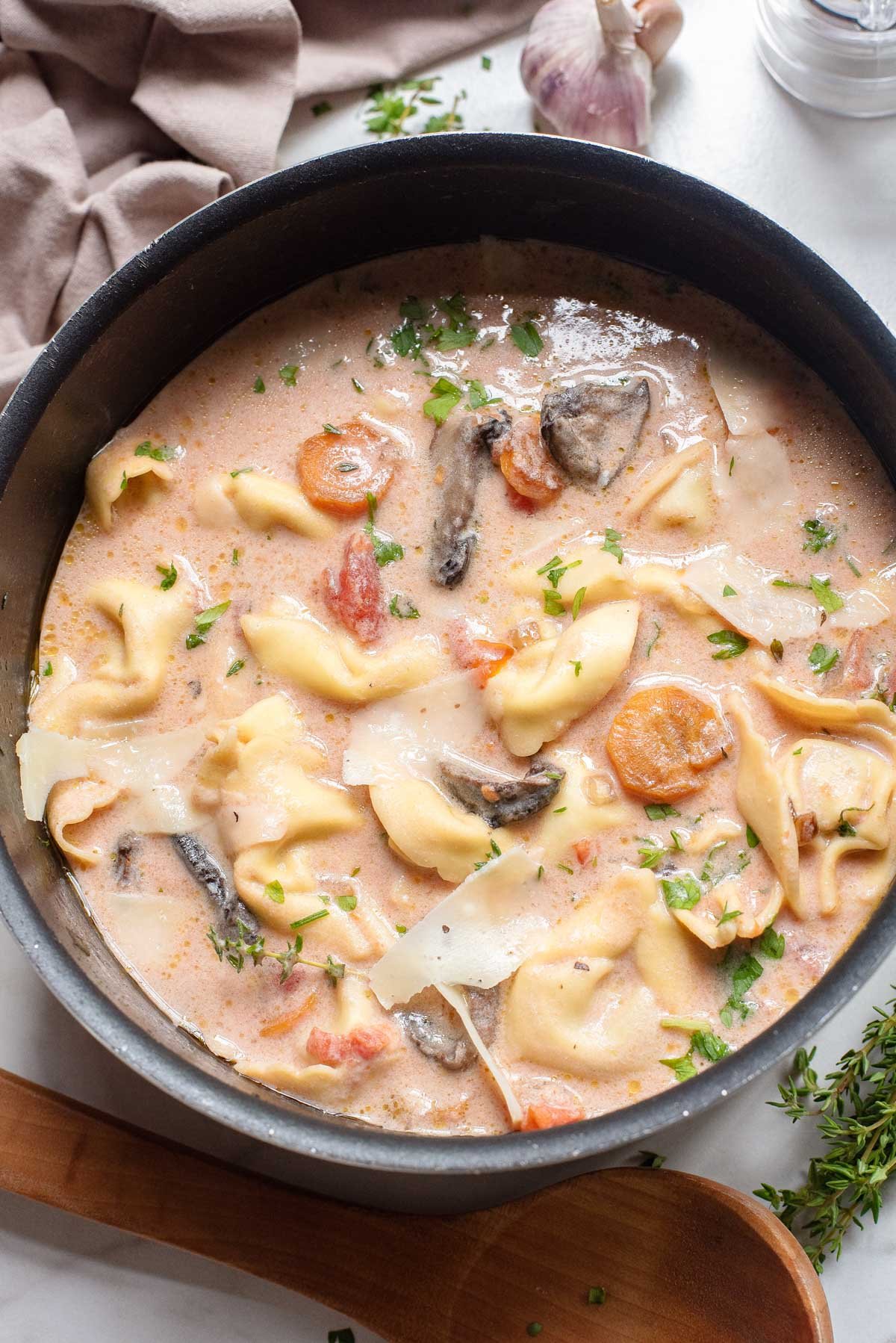 top down view of the finished tomato tortellini soup in a large pot